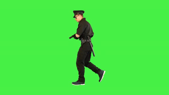 Caucasian Policeman Runs Gets the Gun Out and Aims on a Green Screen Chroma Key