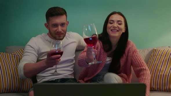 Woman and Man Are Drinking Wine at Home