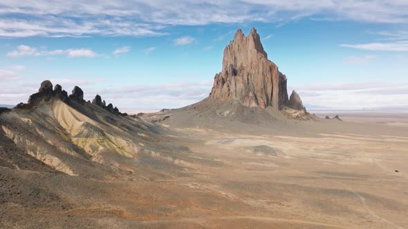 Vehicle Along Dusty and Dirty Path Stretching Within the Desert Around Shiprock