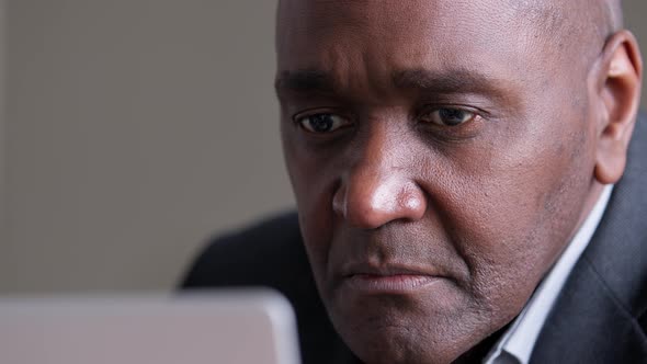 Closeup Male Face of Wrinkled African American Business Man Afro Black Ethnic Mature Boss Leader