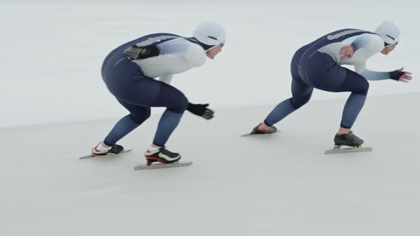 Female Teammates Practicing for Speed Skating Race