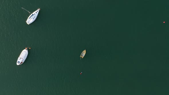 Aerial top down view reveal boats in the river, Seixal