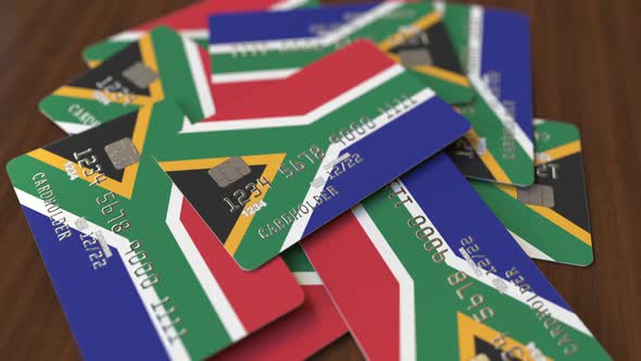 Pile of Credit Cards with Flag of South Africa alt