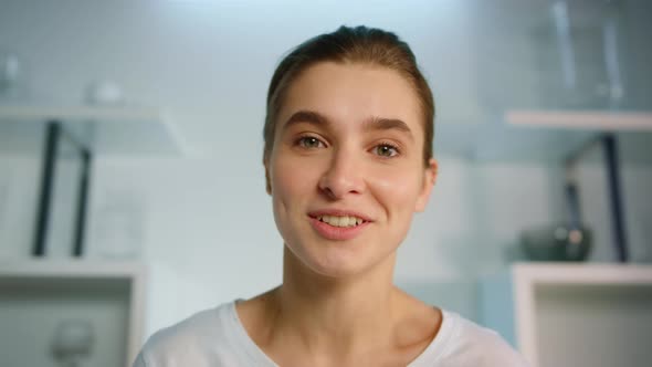 Smiling Woman Using Webcam at Home Closeup