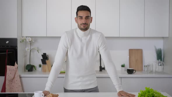 Middle Eastern Young Man Posing in Kitchen at Home