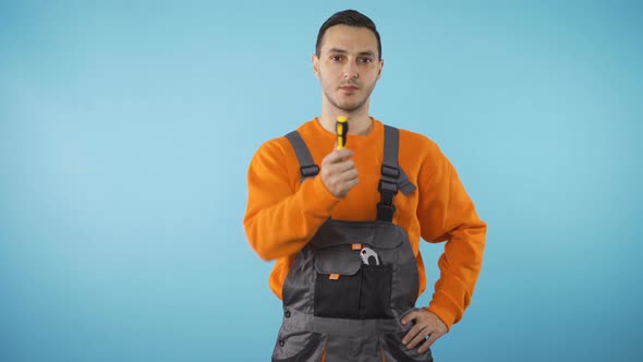 Confident Repairman Fixer Handing Off Screwdriver, Isolated on Blue Background