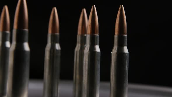Cinematic rotating shot of bullets on a metallic surface - BULLETS 014