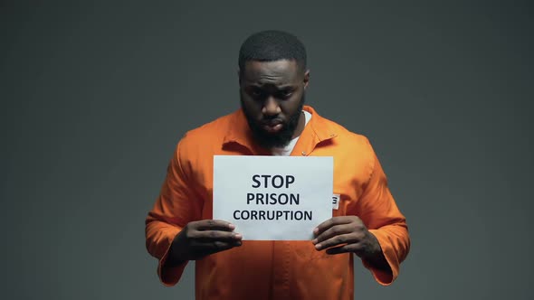 Afro-American Prisoner Holding Stop Prison Corruption Sign, Faulty System