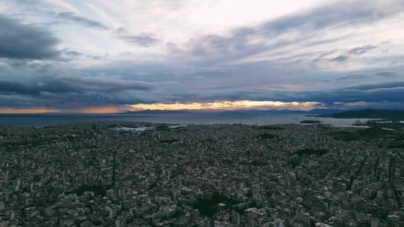 City sunset with clouds and sea 