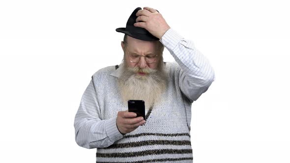Portrait of Senior Man Surfing Internet on Mobile Phone