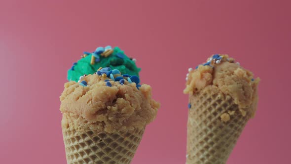 Turquoise Blue and Caramel Ice Cream on a Pink Background