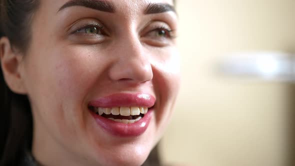 Headshot Joyful Young Caucasian Woman with Permanent Makeup and Toothy Smile Looking Away