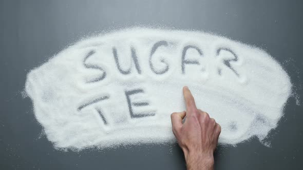 Sugar test written on sugar surface. Stop diabetes.