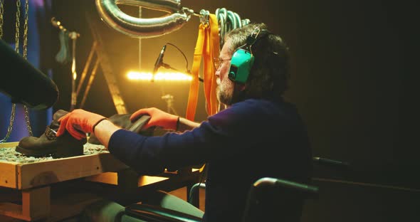 Middle Aged Sound Designer with Disability Imitating Robot Steps
