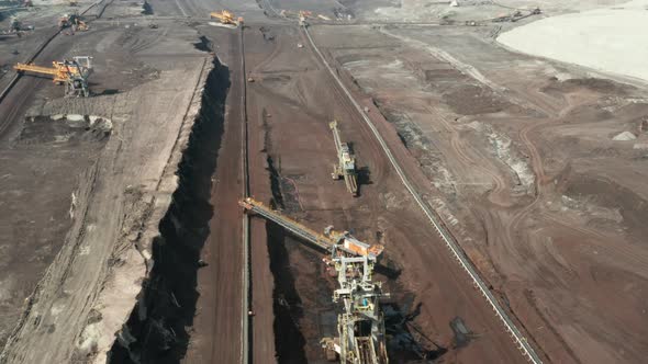 Flight Over the Quarry with Heavy Bucket Wheel Excavators Mining a Coal