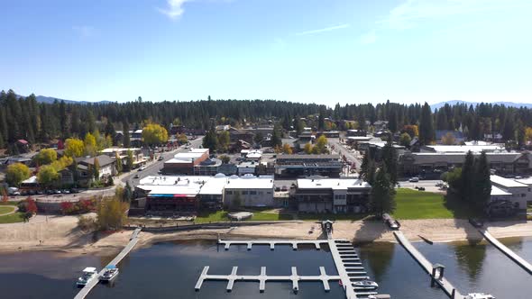 Side scrolling aerial of McCall, Idaho and all of its rural amenities.