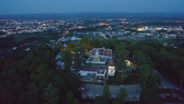 Aerial view of golden buddha pagoda stupa. Wat Phrathat Khao Noi Temple Park, Nan, Thailand