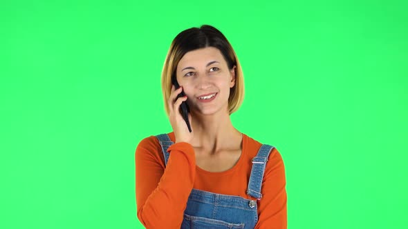 Smiling Girl Talking for Mobile Phone. Green Screen