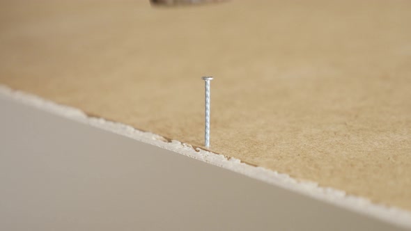 Close Up Hammering Into Plywood Of Wooden Cabinet 4K Footage alt