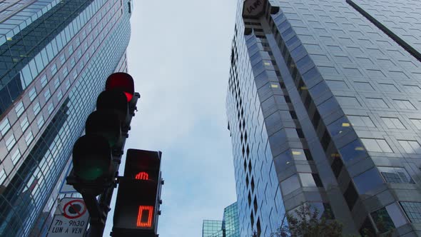 Pan left view of skyscrapers and a traffic light