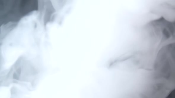 White Smoke Floating Through Space Against Black Background. Mist, Smoke , Vapor, Fog Effect. Slow