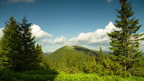 Time Lapse Clouds Move Over Mountain and Forest Rural Landscape