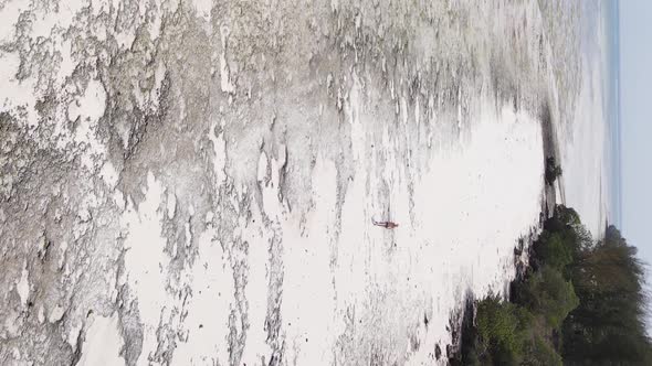 Vertical Video of Low Tide in the Ocean Near the Coast of Zanzibar Tanzania Aerial View