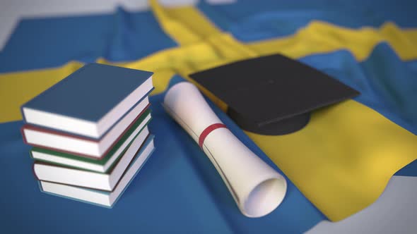 Graduation Cap and Diploma on the Flag of Sweden