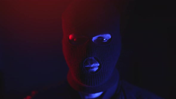 Portrait of an Arrested Criminal in a Mask