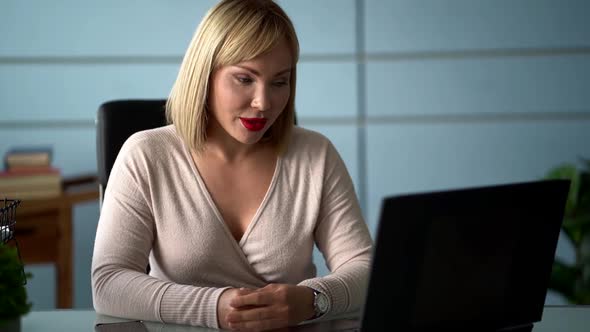 Woman Is Communicating By Web Camera on Working Laptop at Office, Videoconference