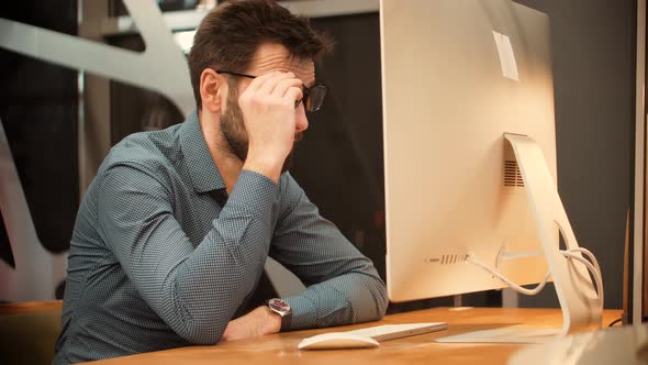 Tired Worker Overworked On Computer. Unhappy Frustrated Businessman. Office Work Overtime.