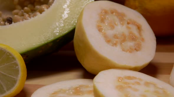 Cut Exotic Fruits Lie on a Bamboo Board