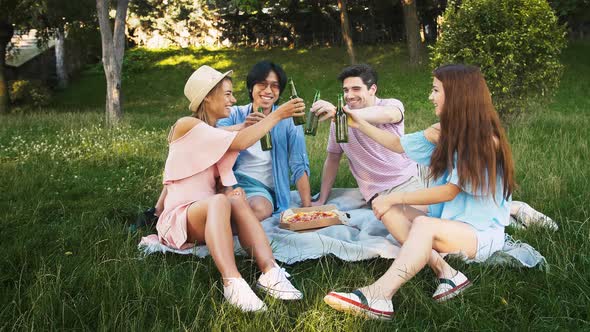 Friends Having Picnic in Park