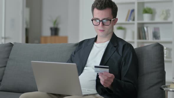 Online Payment Success on Laptop for Designer at Home 