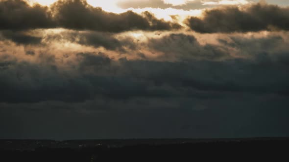 Dramatic Sunset in the Sky Through Orange Layered Cumulus Clouds Timelapse