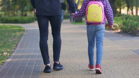 Father Walking With Daughter to School, Holding Hand, Caring About Child Safety