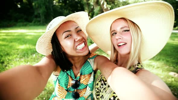 Two young women having fun while taking a selfie