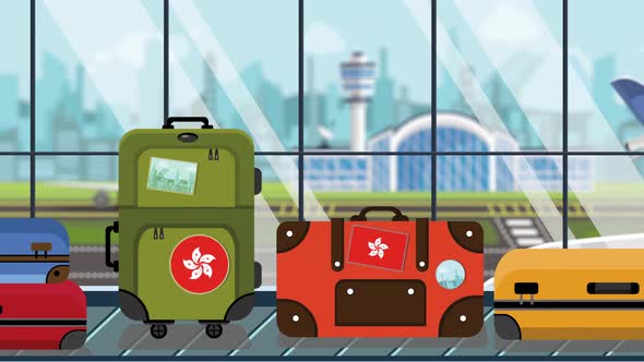 Suitcases with Flag of Hong Kong Stickers on Baggage Carousel
