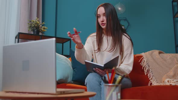 Young Woman Teacher Freelancer Consult Student By Laptop Use Modern Tech for Elearning at Home Room