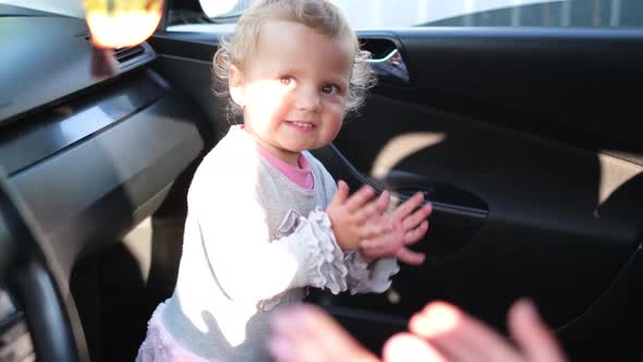 Happy Cute Little Girl Claps Her Hands