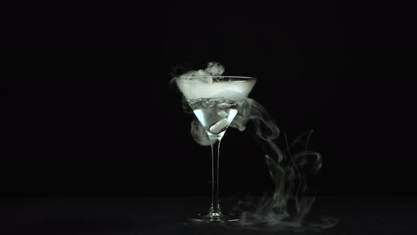 Drink in Glass of Martinis with the Effect of Dry Ice