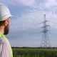 The power engineer looks at the power lines. - VideoHive Item for Sale