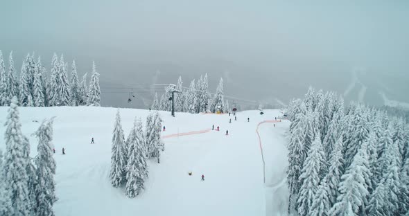 Ski Lift in Foggy Winter Mountains