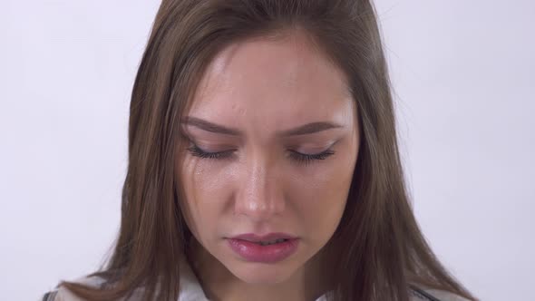 Portrait of Young Crying Woman with Tears