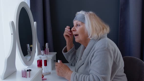 Old Senior Woman Grandmother Applying Eyelash Mascara, Putting Makeup On, Taking Care of Skin