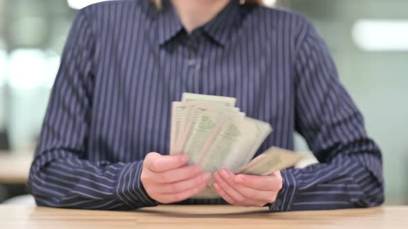 Close Up of Businesswoman Counting Dollar