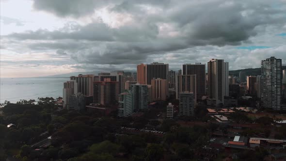 Aerial drone footage of Honolulu, Hawaii. Beautiful real estate, buildings in the city. Palm trees