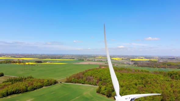 Drone dropping height, view of windmill and landscape