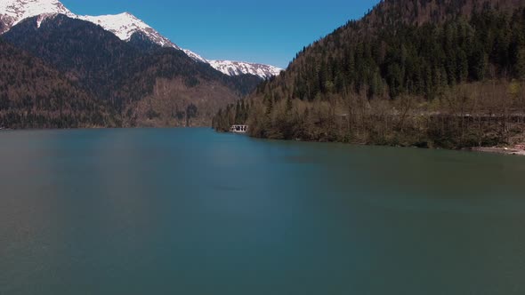 Aerial View on Picturesque River and Huge Mountain in Sunny Day