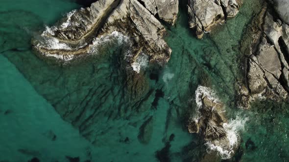 Beautiful turquoise blue tide pools on the Mediterranean. Summertime Milos Greece 4k.